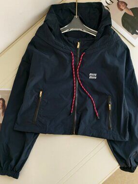 MIUMIU windbreaker, exquisitely tailored with a hood